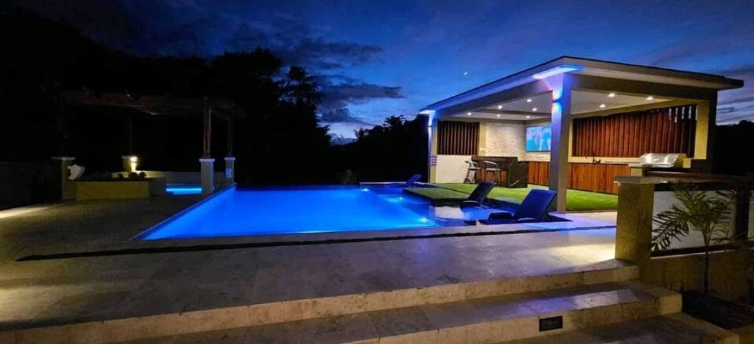 Pool-at-night-with-lights.webp